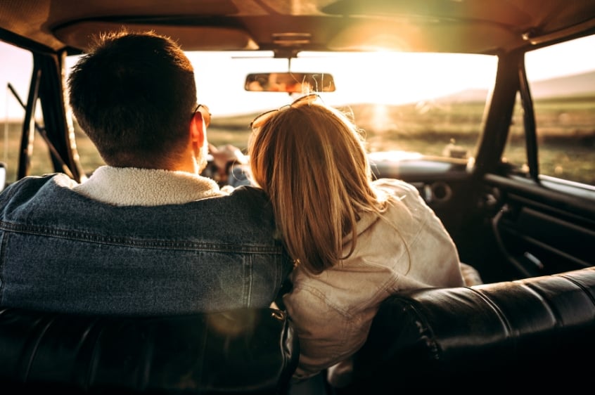 Couple having a roadtrip in Double Bay during sunset