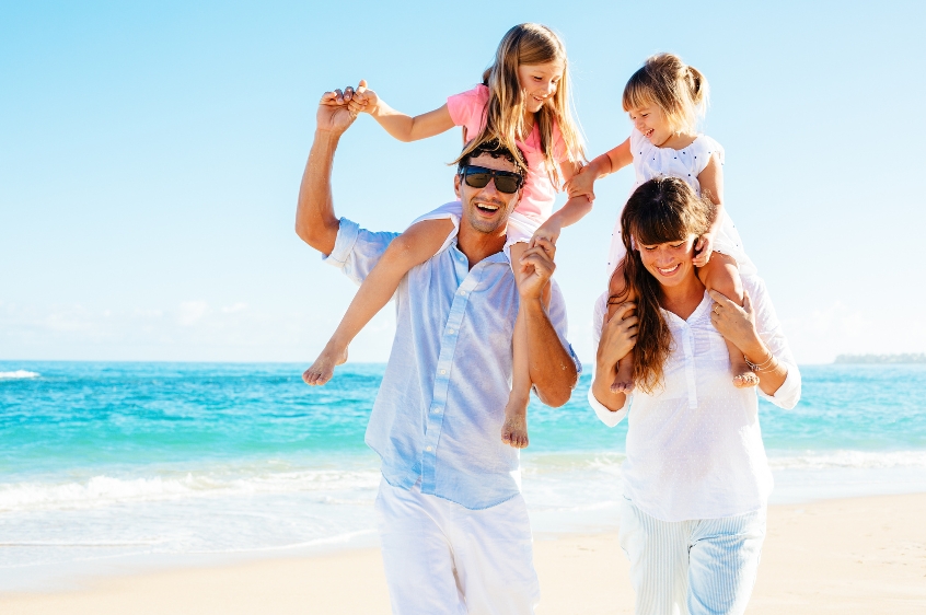 a happy family on the beach